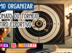 Como Organizar um Torneio de Tiro Esportivo: Guia Completo e Prático Imagem de capa de um torneio de tiro esportivo com alvo perfurado, mesa com medalhas e troféus e fundo de estande de tiro ao ar livre com atletas usando equipamentos de segurança.